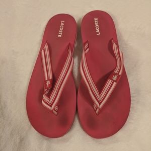 Pink acoste flip flops